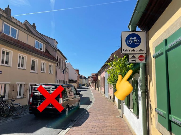 Schilderwald lichten, Parkplätze von Gehwegen runter, eine Fahrradzone und vielleicht ein Poller